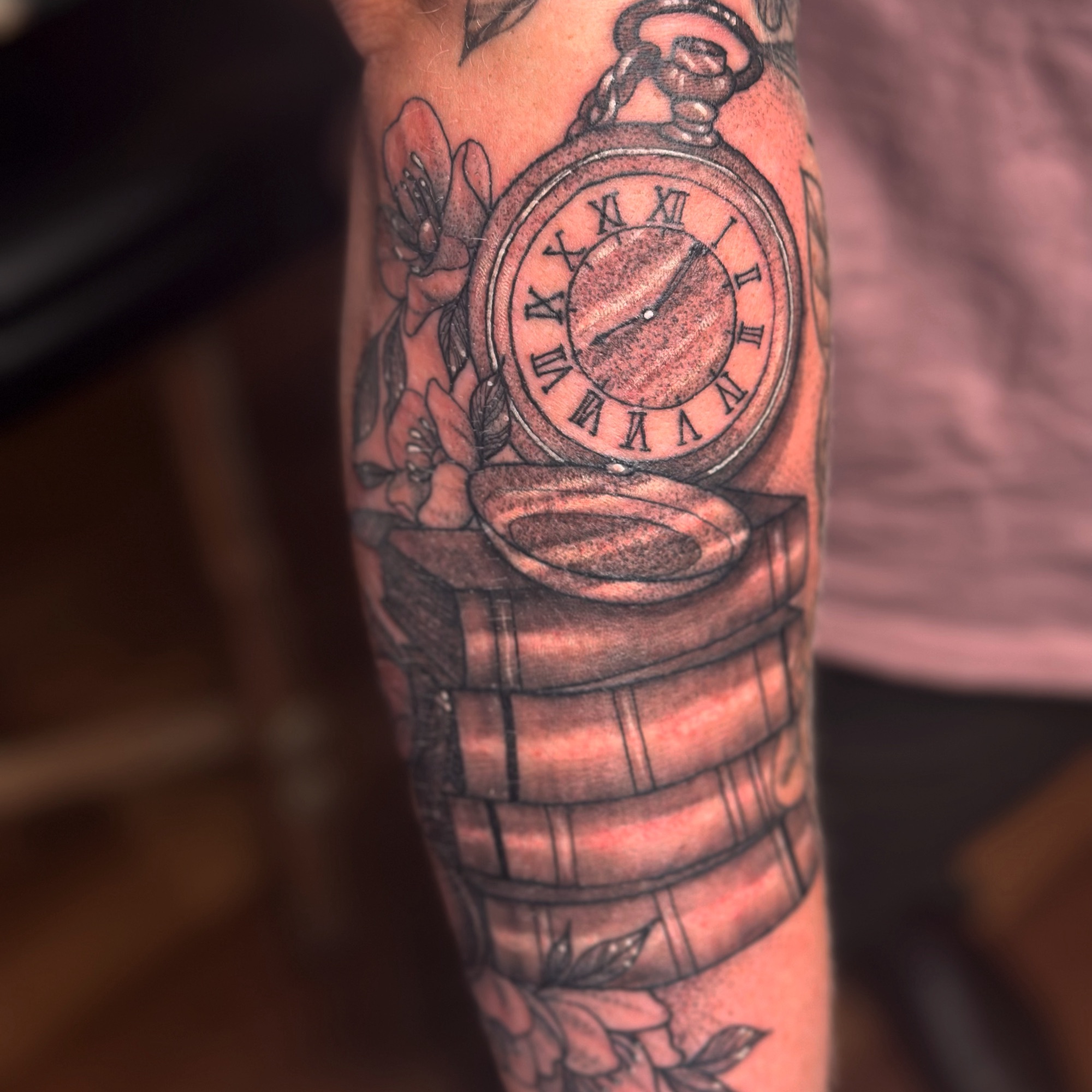 pocketwatch sitting on books